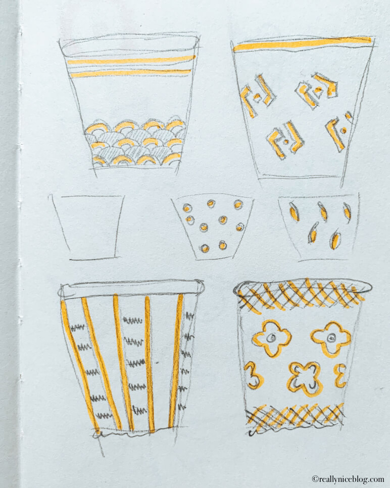 Sketching before painting terracotta pot