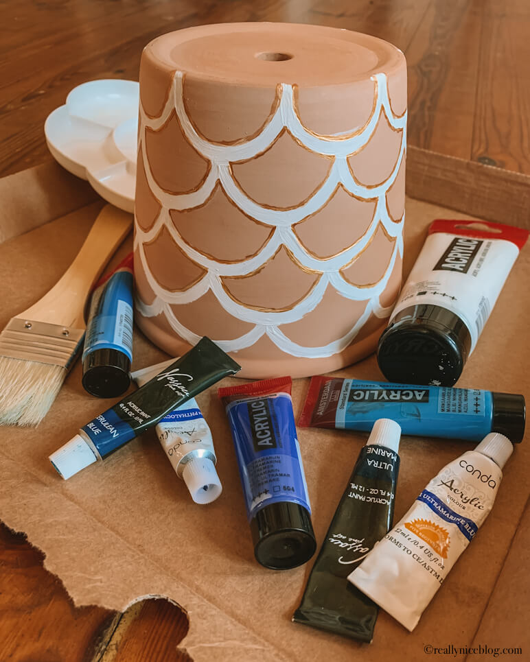 Painting terracotta pots. Acrylic paint and supplies